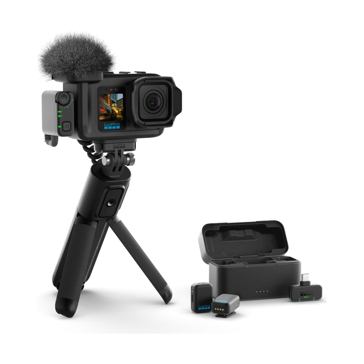 GoPro Mission 1 Pro Creator Edition Camera — creator edition kit on a tripod with microphone wireless components and case view