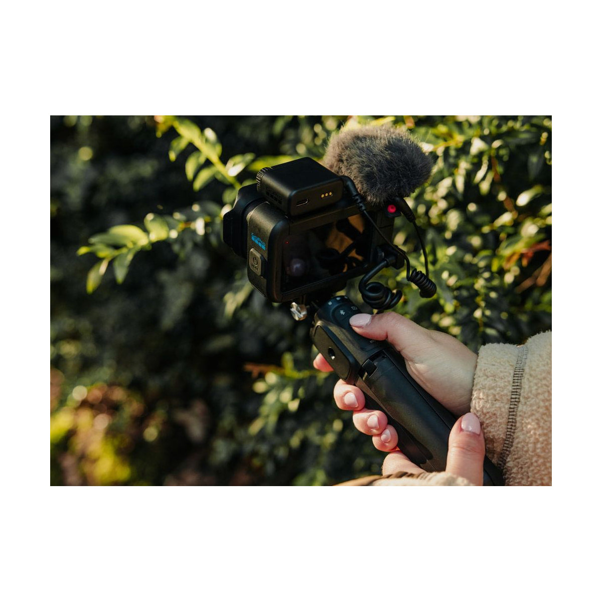 GoPro Mission 1 Pro Creator Edition Camera — creator edition camera rear and side view on handheld grip view