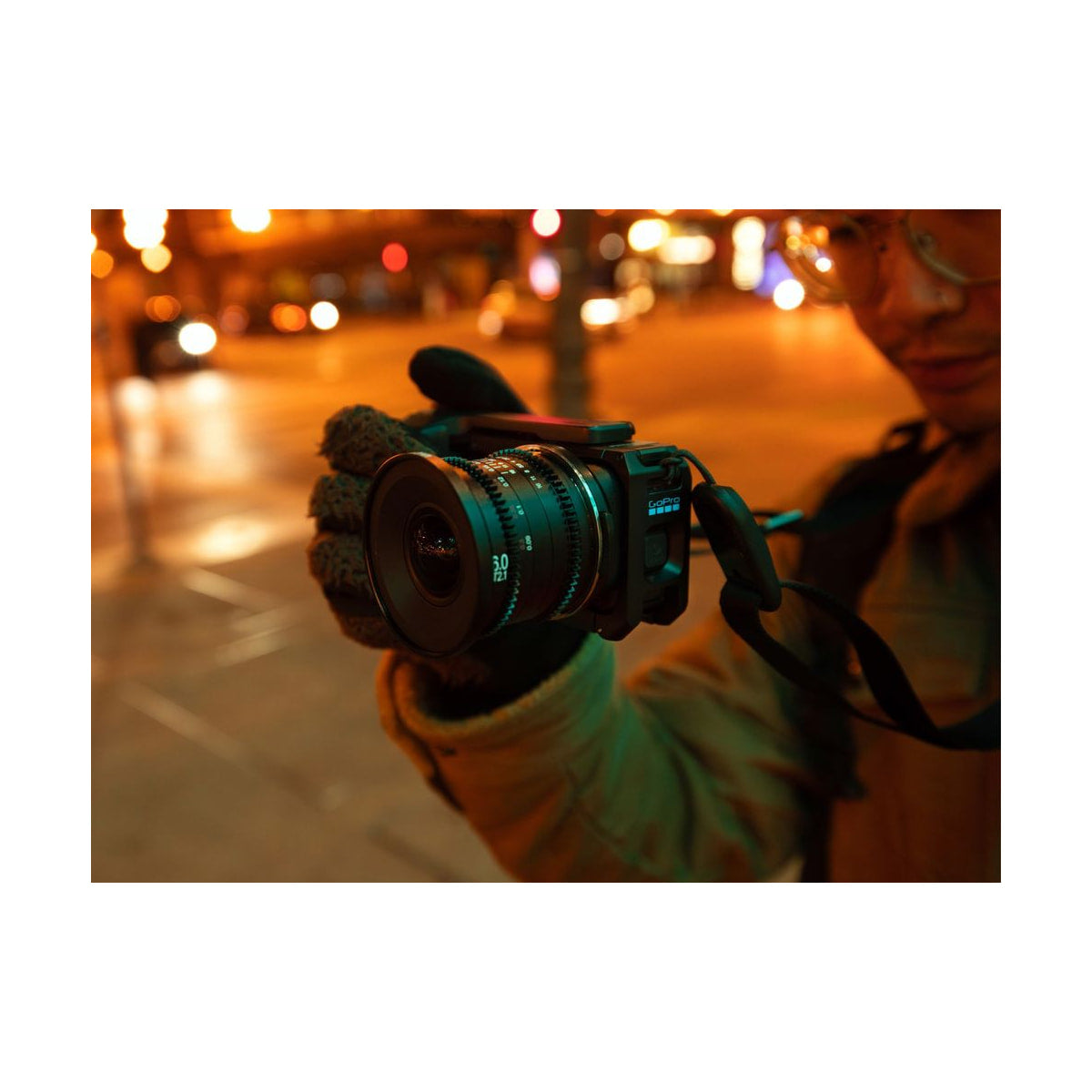 GoPro Mission 1 Pro ILS Camera — camera with cine lens and top microphone in a night street scene view
