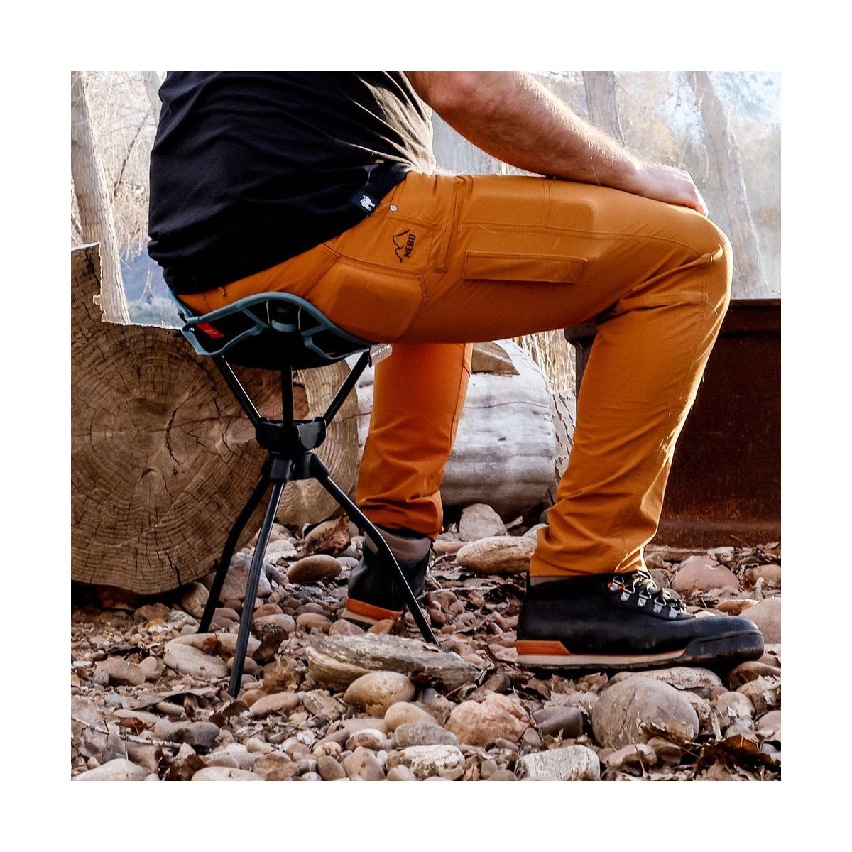 Grand Trunk Compass 360° Extra-Tall Swivel Stool (20", Black) — black stool in use side view view