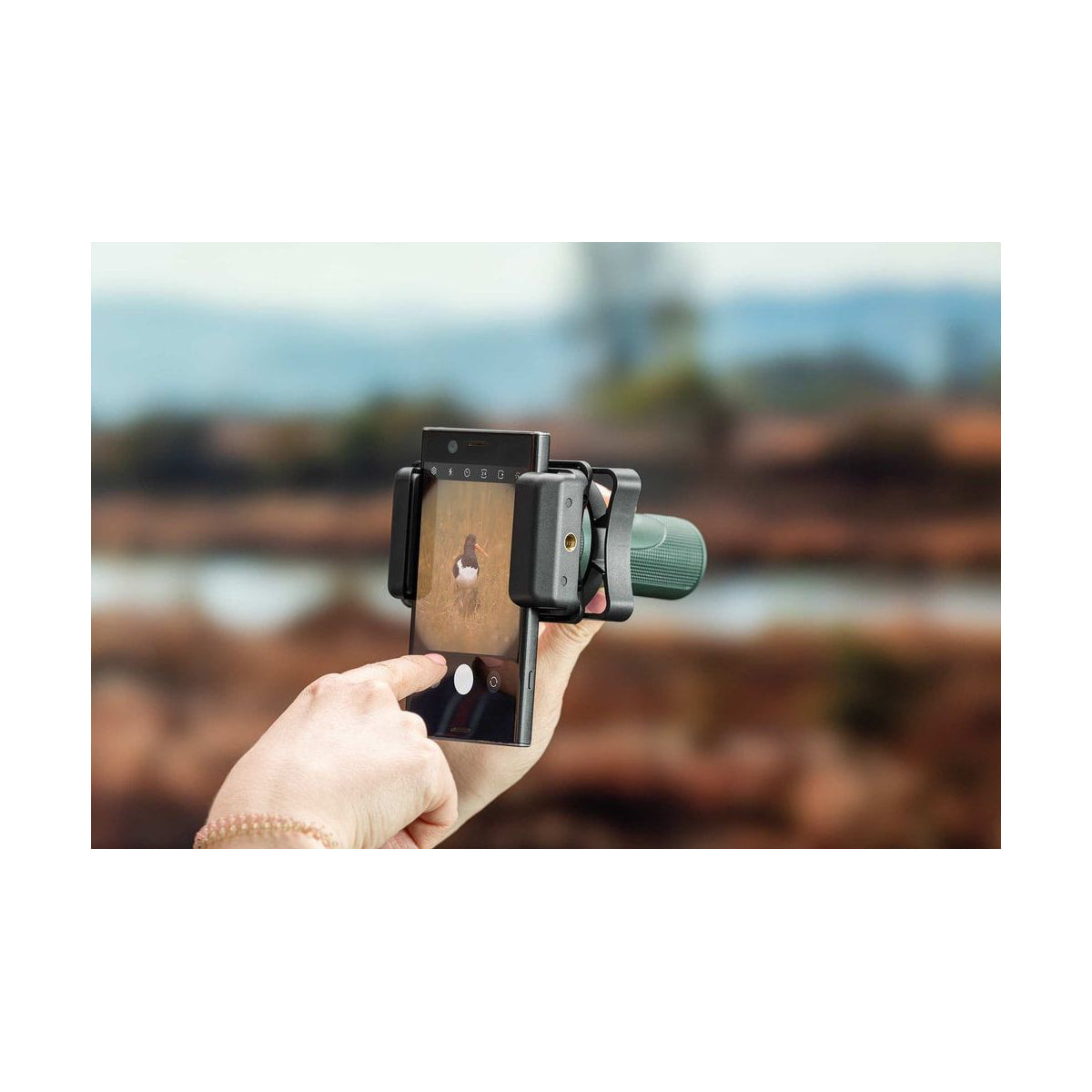 Hawke Smartphone Adapter — adapter in use with smartphone and spotting scope view
