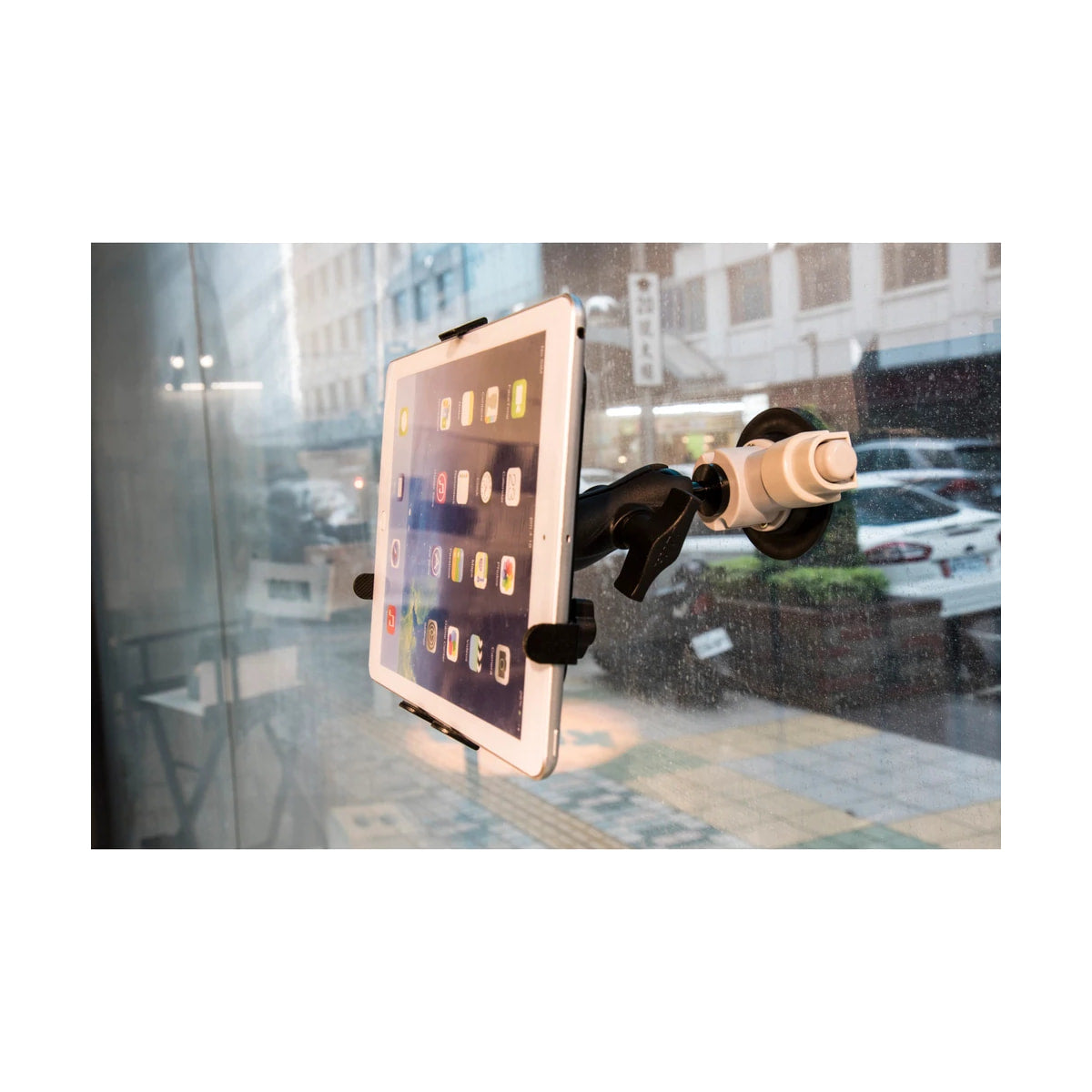 Kupo Super Knuckle Universal Tablet Holder — tablet holder mounted to window view