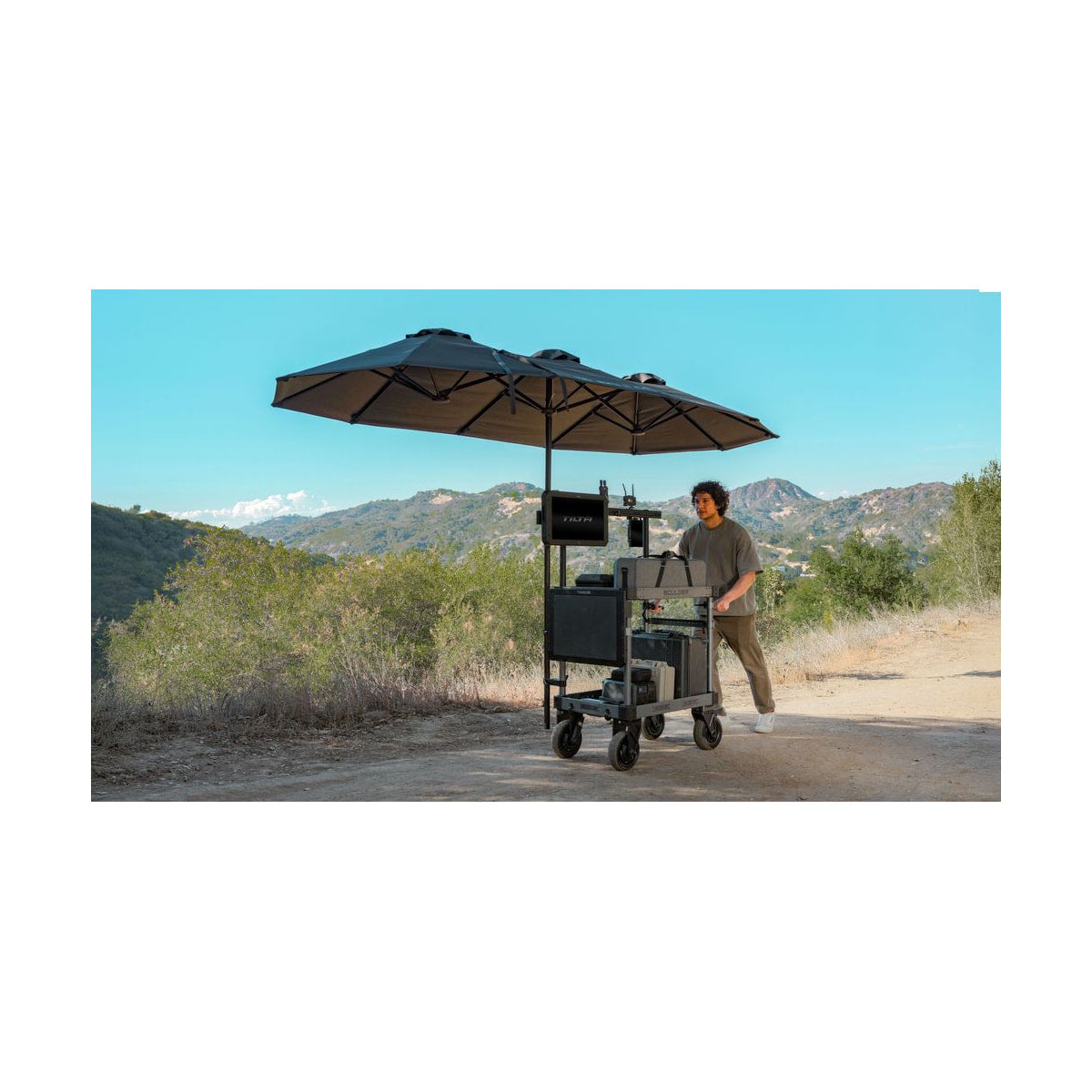 Tilta Extended Umbrella Kit for Boulder Camera Cart (Black) — two black umbrellas installed on a boulder camera cart outdoors view