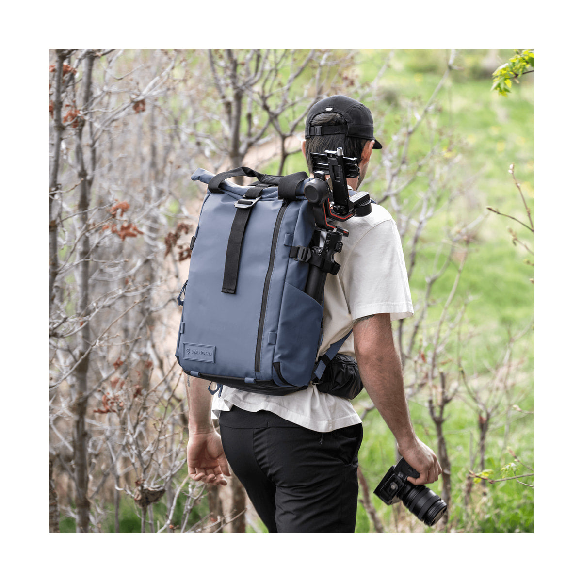 WANDRD PRVKE 21 V4 Backpack w/Photo Bundle (Aegean Blue) — rear lifestyle view with camera rig attached view